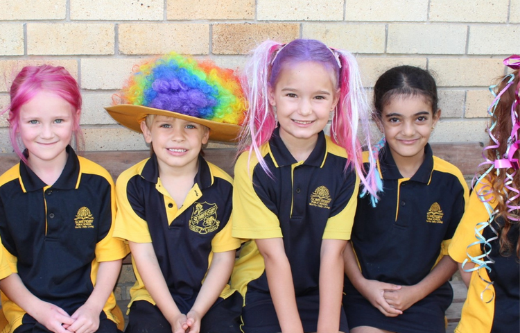 four students with crazy hair